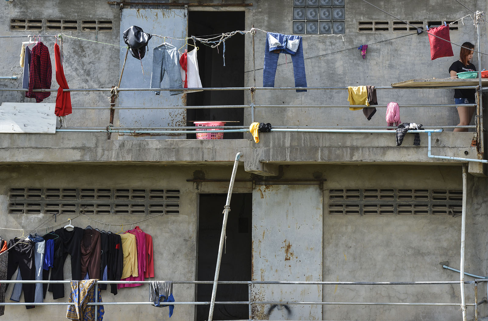 A laundry day in Phnom Penh, Cambodia factory workers hanging up their clothes to dry